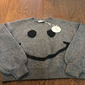 Brand new Storia smiley face sweater.